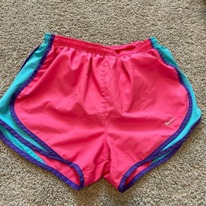 Nike pink, blue, and purple Nike shorts with panty liner